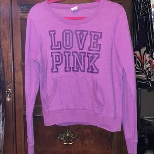 pink sweatshirt.